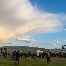 Festival Grounds at Fire in the Mountains 2019 with rainbow in the background