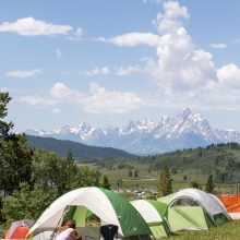 A picture of the camping at Fire in the Mountains 2019 with the Tetons in the background